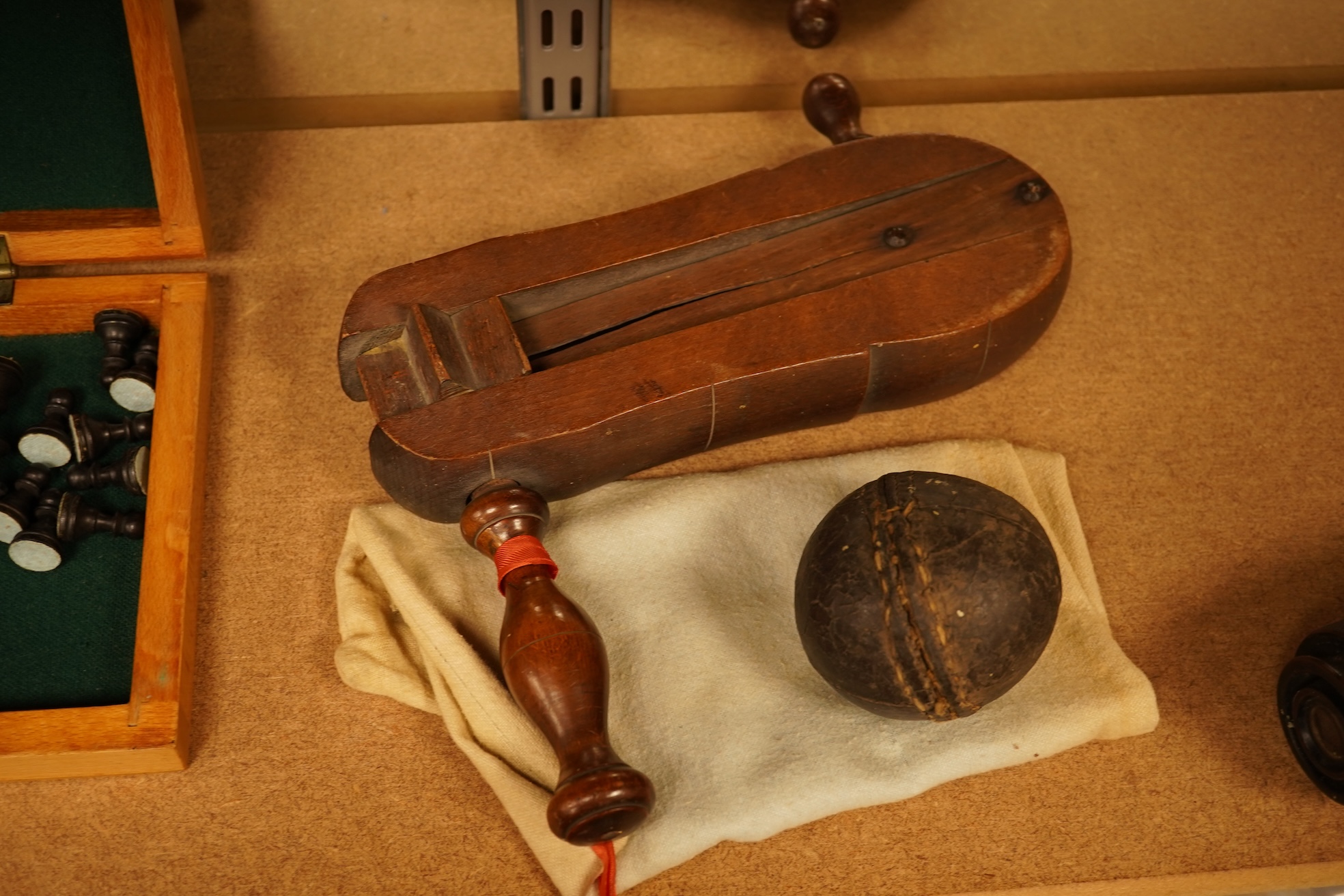 Two boxed chess sets, a cricket ball and a bird scaring rattle, largest chess set 32cm wide x 9cm high x 20cm deep.